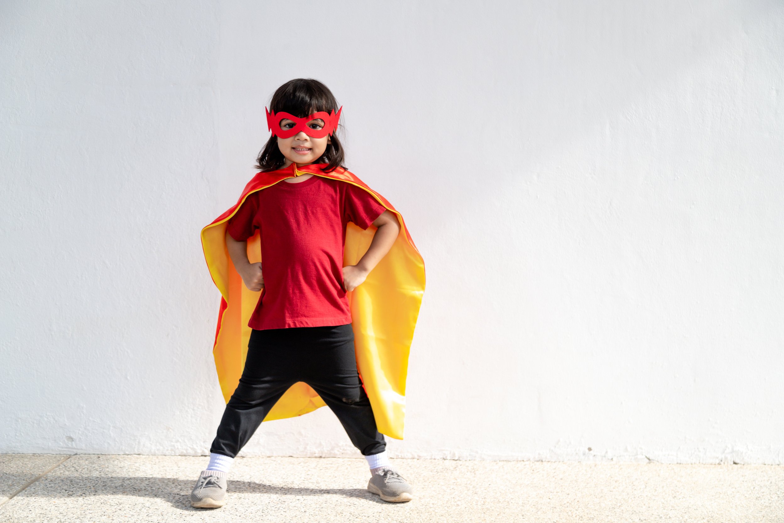 Kids Concept, Smiling Girl Playing Super Hero on White Backgroun